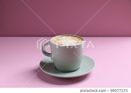 hot cappuccino with latte art isolated in pink background hot cappuccino with latte art isolated in pink background 96077235