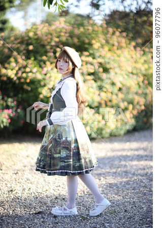 A beautiful woman in lolita dress in garden background Japanese street fashion portrait A beautiful woman in lolita dress in garden background Japanese street fashion portrait 96077796