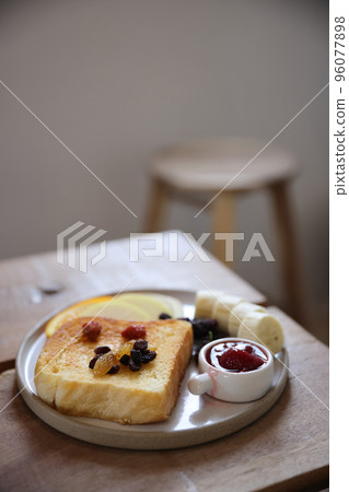 Toast breakfast with dried berry and jam on wood background 96077898