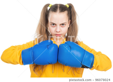 serious teen girl boxer in boxing gloves ready to fight and punch isolated on white, power 96078024