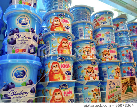 JOHOR, MALAYSIA -JULY 6, 2022: Yogurt in commercial packs. Small cup size and perfect for one serving. Sorted by brand and flavor. Labeled with a clear price tag. JOHOR, MALAYSIA -JULY 6, 2022: Yogurt in commercial packs. Small cup size and perfect for one serving. Sorted by brand and flavor. Labeled with a clear price tag. 96078364