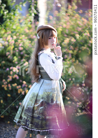 A beautiful woman in lolita dress in garden background Japanese street fashion portrait A beautiful woman in lolita dress in garden background Japanese street fashion portrait 96078411