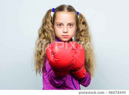 Girl cute child with red gloves posing on white background. Cute kid with sport boxing gloves. Boxing sport for female. Sport upbringing. Skill of successful leader. Sport upbringing for leader 96078445