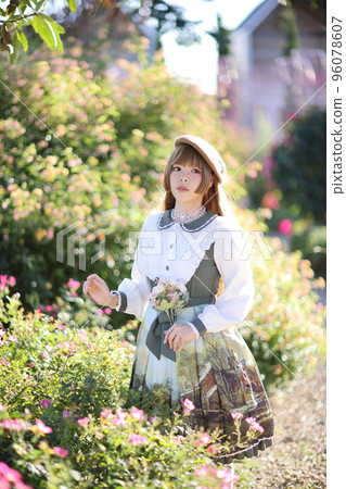 A beautiful woman in lolita dress in garden background Japanese street fashion portrait A beautiful woman in lolita dress in garden background Japanese street fashion portrait 96078607
