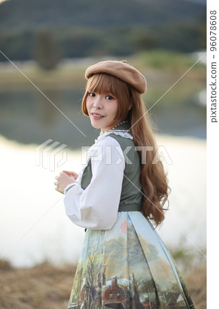 A beautiful woman in lolita dress in garden background Japanese street fashion portrait A beautiful woman in lolita dress in garden background Japanese street fashion portrait 96078608