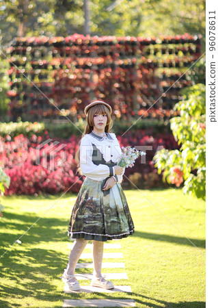 A beautiful woman in lolita dress in garden background Japanese street fashion portrait A beautiful woman in lolita dress in garden background Japanese street fashion portrait 96078611