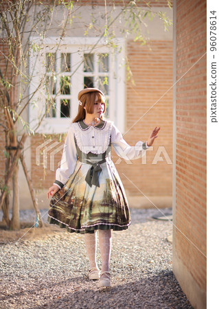A beautiful woman in lolita dress in garden background Japanese street fashion portrait A beautiful woman in lolita dress in garden background Japanese street fashion portrait 96078614