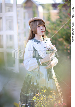 A beautiful woman in lolita dress in garden background Japanese street fashion portrait A beautiful woman in lolita dress in garden background Japanese street fashion portrait 96078615