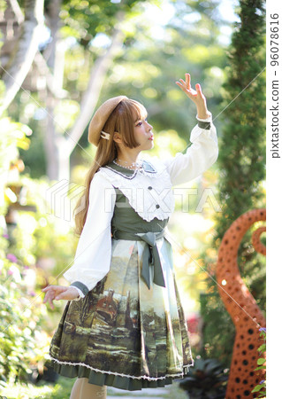 A beautiful woman in lolita dress in garden background Japanese street fashion portrait A beautiful woman in lolita dress in garden background Japanese street fashion portrait 96078616
