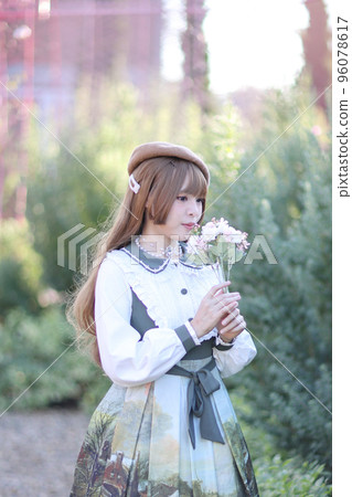 A beautiful woman in lolita dress in garden background Japanese street fashion portrait A beautiful woman in lolita dress in garden background Japanese street fashion portrait 96078617