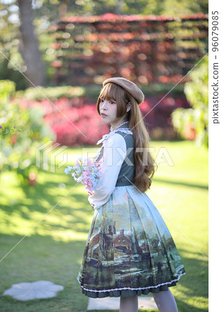 A beautiful woman in lolita dress in garden background Japanese street fashion portrait A beautiful woman in lolita dress in garden background Japanese street fashion portrait 96079085