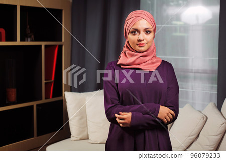 Beautiful Muslim woman with traditional oriental attire, at home 96079233