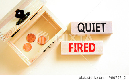 Quiet fired symbol. Concept words Quiet fired on wooden blocks. Beautiful white table white background. Wooden chest with coins. Business and quiet fired concept. Copy space. Quiet fired symbol. Concept words Quiet fired on wooden blocks. Beautiful white table white background. Wooden chest with coins. Business and quiet fired concept. Copy space. 96079242
