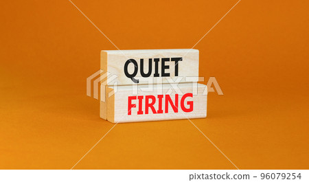 Quiet firing symbol. Concept words Quiet firing on wooden blocks. Beautiful orange table orange background. Business and quiet firing concept. Copy space. Quiet firing symbol. Concept words Quiet firing on wooden blocks. Beautiful orange table orange background. Business and quiet firing concept. Copy space. 96079254
