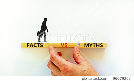 Facts vs myths symbol. Concept words Facts vs myths on wooden blocks on a beautiful white table white background. Businessman hand. Business, finacial and facts vs myths concept. Copy space. 96079262