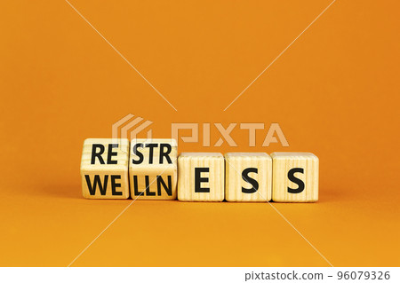 Restress for wellness symbol. Concept words Restress and Wellness on wooden cubes. Beautiful orange table orange background. Business Restress for wellness concept. Copy space. Restress for wellness symbol. Concept words Restress and Wellness on wooden cubes. Beautiful orange table orange background. Business Restress for wellness concept. Copy space. 96079326