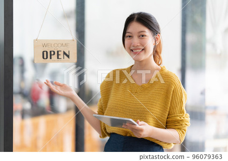Portrait of Startup successful small business owner in coffee shop. SME entrepreneur seller business concept Portrait of Startup successful small business owner in coffee shop. SME entrepreneur seller business concept 96079363