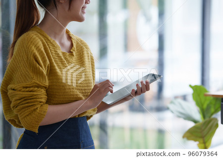 Portrait of Startup successful small business owner in coffee shop. SME entrepreneur seller business concept Portrait of Startup successful small business owner in coffee shop. SME entrepreneur seller business concept 96079364