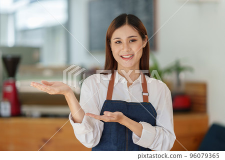 Portrait of Startup successful small business owner in coffee shop. SME entrepreneur seller business concept Portrait of Startup successful small business owner in coffee shop. SME entrepreneur seller business concept 96079365