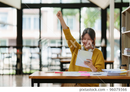 Attractive female student learning language, watching online webinar, listening audio course, e-learning education concept Attractive female student learning language, watching online webinar, listening audio course, e-learning education concept 96079366