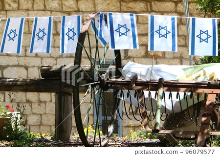 The blue and white flag of Israel with the Star of David. 96079577