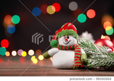 funny snowman on a Christmas evening background. 96080868