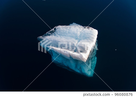 Big piece of ice in sea water Big piece of ice in sea water 96080876
