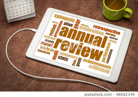 annual review word cloud on tablet 96082340