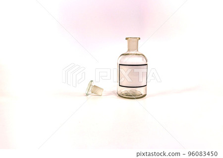Transparent medical jar with a glass stopper on a white background Transparent medical jar with a glass stopper on a white background 96083450