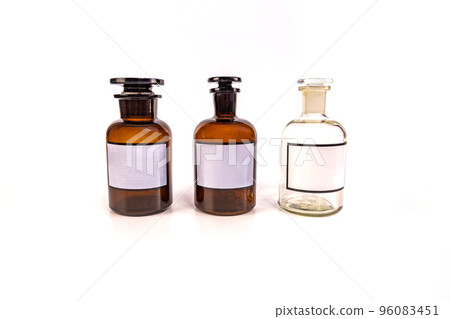 Three medical jars with glass stoppers on a white background Three medical jars with glass stoppers on a white background 96083451