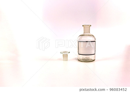 Transparent medical jar with a glass stopper on a white background Transparent medical jar with a glass stopper on a white background 96083452