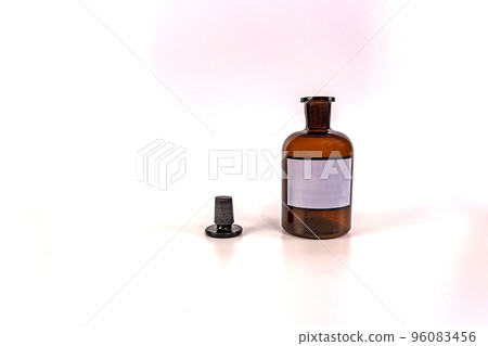 Brown medical jar with a glass stopper on a white background with a label Brown medical jar with a glass stopper on a white background with a label 96083456