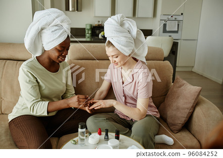 Girls Doing Manicure at Home 96084252