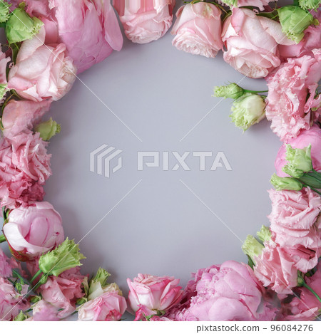 Peonies and roses on pastel blue background making frame with copy space. Natural floral layout with space for text. Romantic feminine composition. Wedding invitation. International Women, Mother Day 96084276