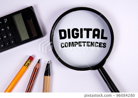 Digital Competences. Magnifying glass and stationery on a white background Digital Competences. Magnifying glass and stationery on a white background 96084280
