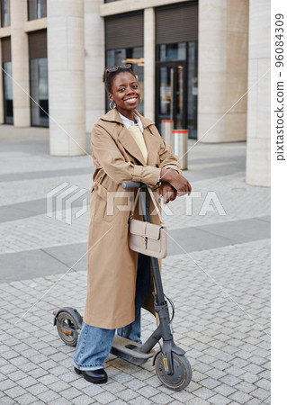 Stylish Black Woman With Scooter in City 96084309