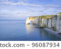 Coastal landscape along the Falaise d'Aval the famous white cliffs of Etretat village 96087934