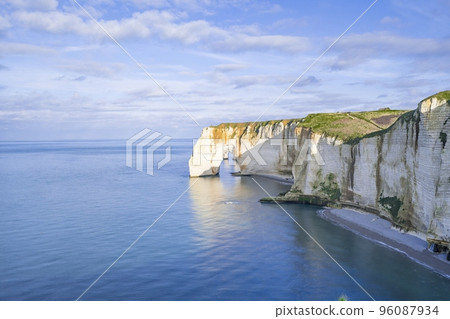 Coastal landscape along the Falaise d'Aval the famous white cliffs of Etretat village Coastal landscape along the Falaise d'Aval the famous white cliffs of Etretat village 96087934