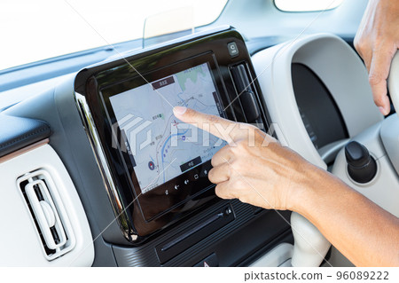 Hand of men who operate car navigation system Hand of men who operate car navigation system 96089222