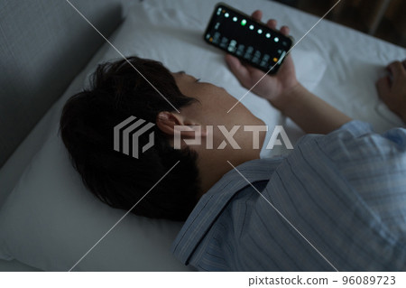 A man in his 40s in the bedroom 96089723