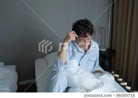 A man in his 40s in the bedroom A man in his 40s in the bedroom 96089738