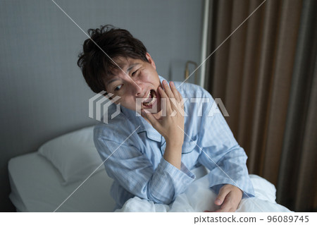 A man in his 40s in the bedroom A man in his 40s in the bedroom 96089745