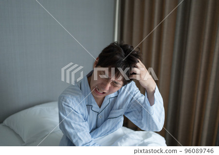 A man in his 40s in the bedroom A man in his 40s in the bedroom 96089746
