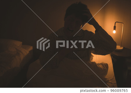 A man in his 40s in the bedroom 96089765