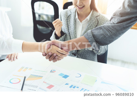 business merger, Asian businessmen shake hands at the conference room with showcase their collaboration to strengthen their marketing efforts. business merger, Asian businessmen shake hands at the conference room with showcase their collaboration to strengthen their marketing efforts. 96089810