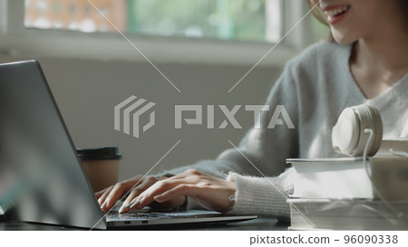 Happy young Asian student girl using laptop in university campus or at virtual office. College female student learning remotely. Happy young Asian student girl using laptop in university campus or at virtual office. College female student learning remotely. 96090338