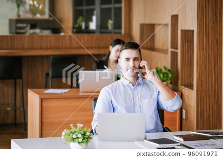 Male marketing manager using phone to talk to venture capital firm to increase profit potential 96091971