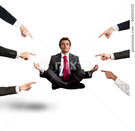 Relaxed businessman under the accusations of colleagues 96093029