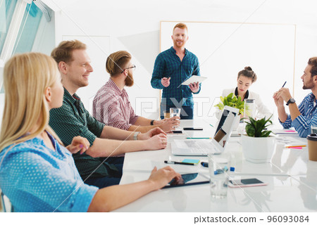 Team of businessmen work together in office. Concept of teamwork and partnership 96093084