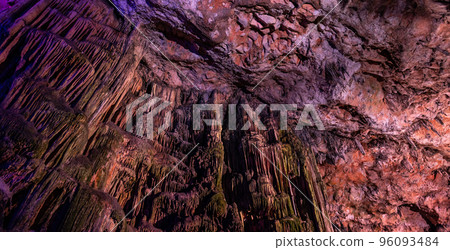 Saint Michael's Cave with colorful lights. Natural Rock Formation. Gibraltar, UK. Background Saint Michael's Cave with colorful lights. Natural Rock Formation. Gibraltar, UK. Background 96093484